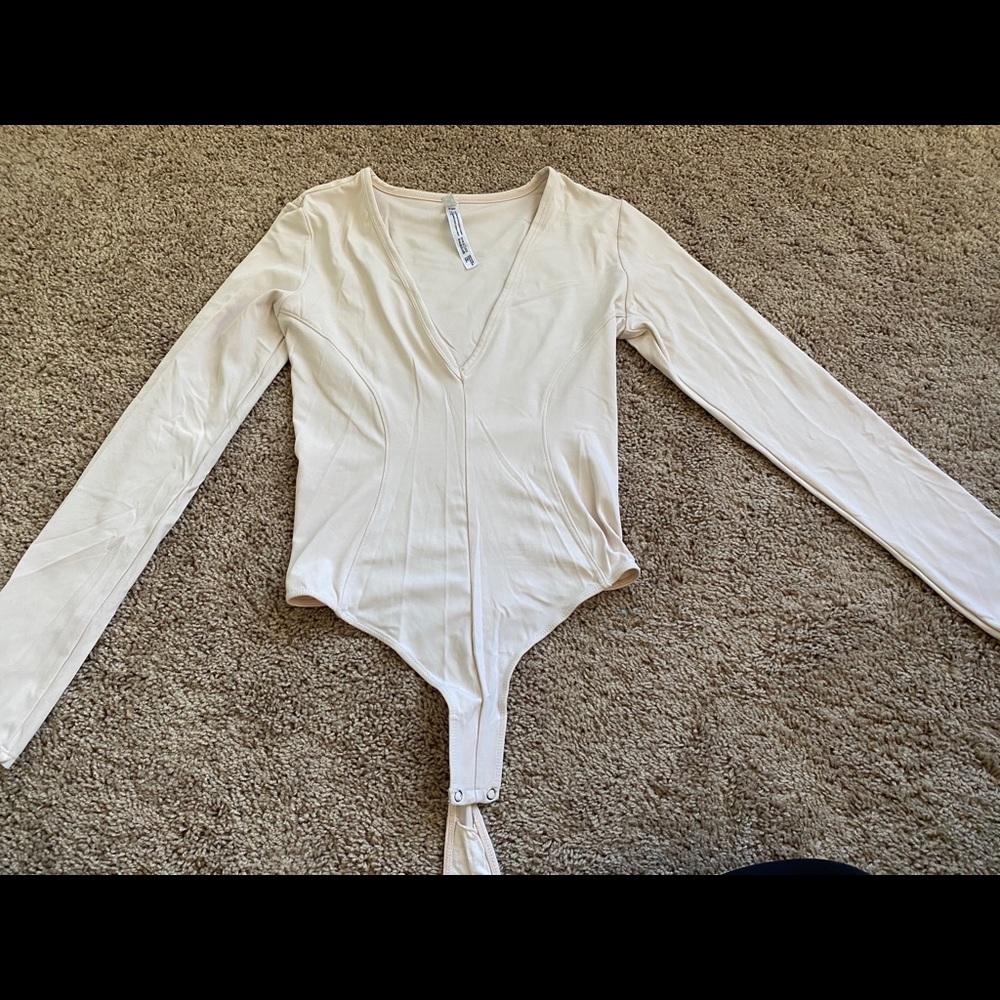 Small light pink Free People bodysuit